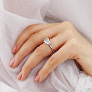 oval-shaped-moissanite-three-stone-style-engagement-ring