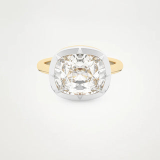 Gold ring with a large diamond on a light gray background