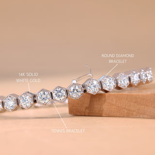 Diamond bracelet with labels indicating '14k solid white gold', 'round diamond bracelet', and 'tennis bracelet' on a beige background.