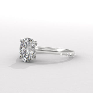  elegant oval diamond ring, oval diamond ring for her, oval cut diamond gold band, custom oval diamond ring, modern oval engagement ring, oval cut diamond with side stones, oval diamond three stone ring, oval cut diamond ring setting, oval diamond prong setting, luxury oval diamond ring