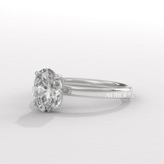  elegant oval diamond ring, oval diamond ring for her, oval cut diamond gold band, custom oval diamond ring, modern oval engagement ring, oval cut diamond with side stones, oval diamond three stone ring, oval cut diamond ring setting, oval diamond prong setting, luxury oval diamond ring