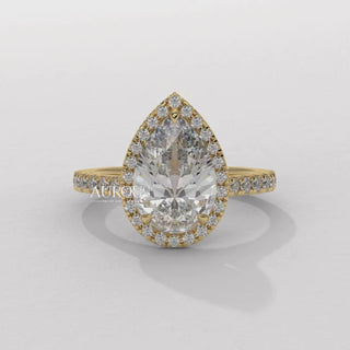 pear cut diamond with side stones, pear diamond three stone ring, pear shaped diamond gold band, custom pear diamond ring, modern pear engagement ring, pear cut diamond prong setting, pear diamond ring setting