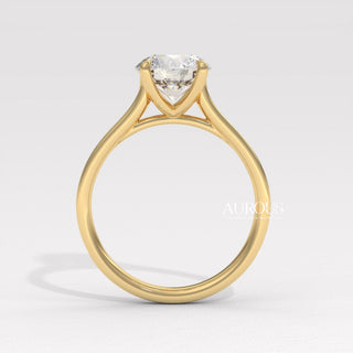 round cut engagement ring in gold, gold ring with round diamond, round diamond gold ring setting, delicate round cut ring, round cut diamond in bezel setting, custom gold engagement ring
