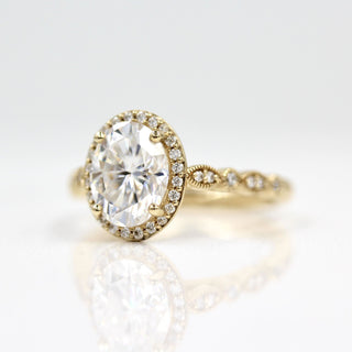 Vintage-inspired halo moissanite engagement rings with diamond accents