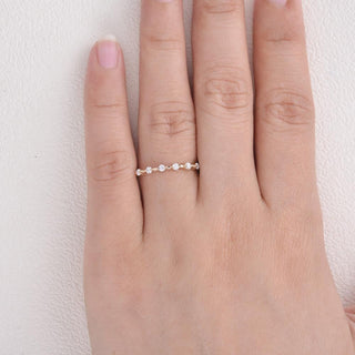 Moissanite engagement rings with minimalist sculptural accents