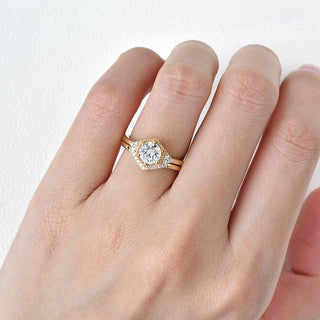 Vintage-inspired three-stone moissanite engagement rings with yellow gold