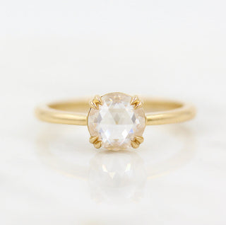 Vintage-inspired three-stone moissanite engagement rings with diamond accents