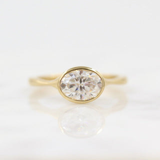 Vintage-inspired oval moissanite engagement rings with diamond accents