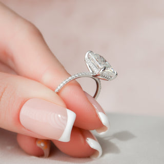 Moissanite ring on a delicate hand