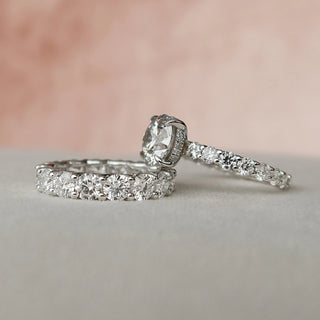 Vintage-inspired three-stone moissanite engagement rings with rose gold