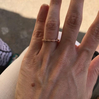 Moissanite engagement rings with minimalist intertwined motifs